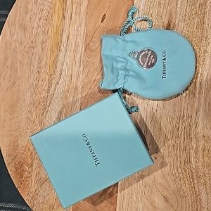 Tiffany & Co. 925 SS Return to Tiffay round tag charm.